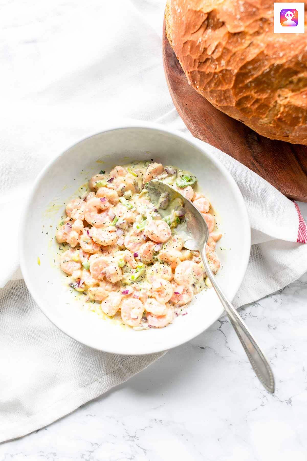 Shrimp salad on toast and crackers.